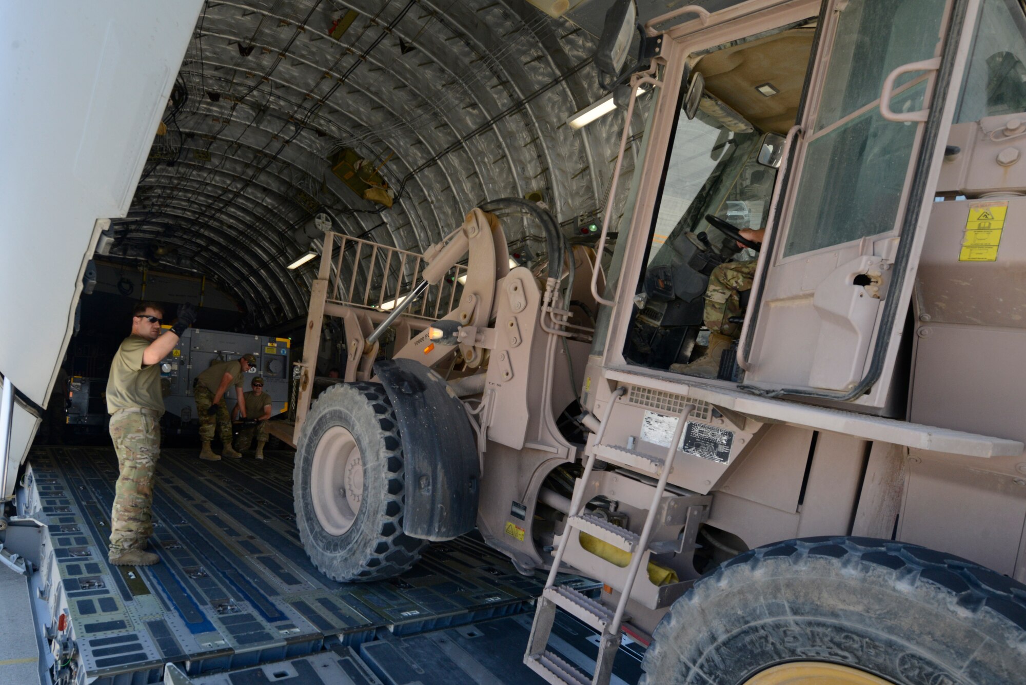 Airmen transporting gear.