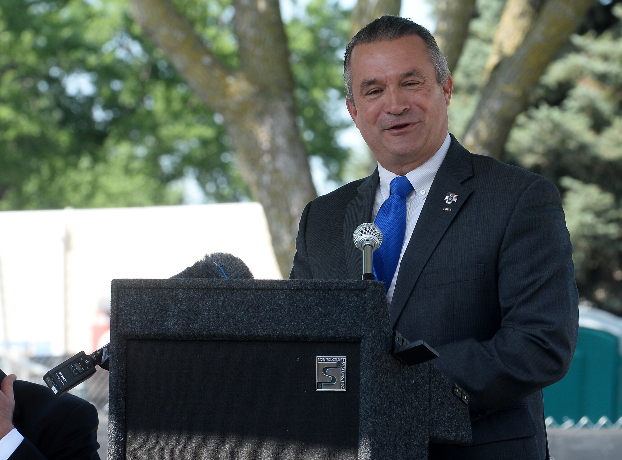 Don Bacon, United States Congressman, speaks to a crowd during a groundbreaking ceremony for the Fisher House project at the Veteran Affairs Medical Center in Omaha, Nebraska, Aug. 7, 2019. Fisher Houses offer  free temporary lodging so military and veteran families can remain together while their loves ones receive specialized medical care at military and VA medical centers.