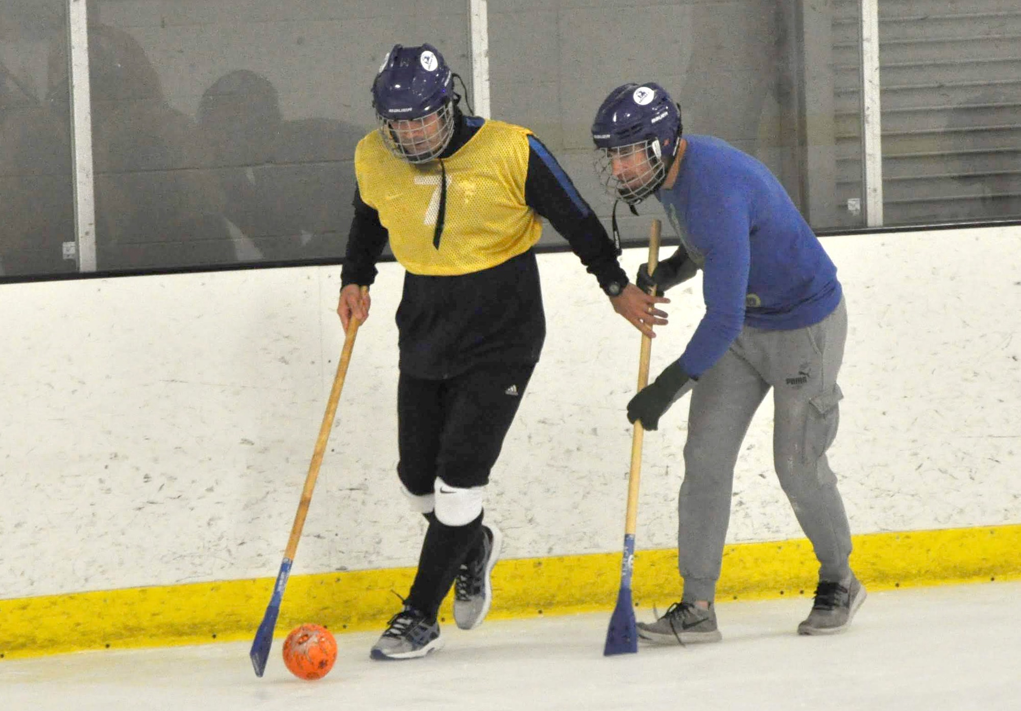 Lt. Col David Manrrique, 38th Reconnaissance Squadron commander, controls the ball as Maj. Nick Christi, 38th RS assistant director of operations, attempts to steal during a game of Broomball June 21, 2019, at Grover Ice Rink, Omaha, Nebraska. This resiliency event was made possible through funds from the Unite Program set up by the Air Force Services Activity earlier this year to promote unit cohesion. The program is the vision of Gen. David L. Goldfein, Air Force chief of staff, who recognized the need to take care of our squadrons by allowing units to focus on resiliency and cohesion for its members.