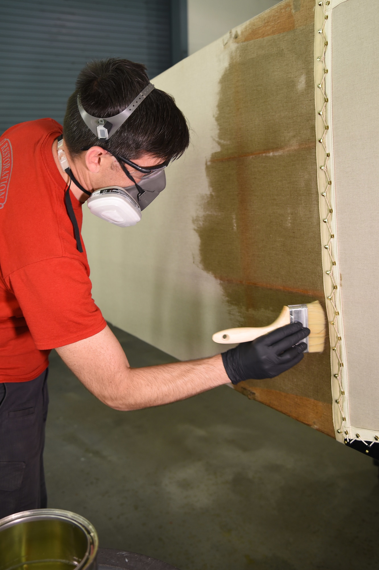 DAYTON, Ohio -- Museum restoration specialist Casey Simmons applies 50/50 dope to the Avro 504K fuselage on Aug. 7, 2019. This aircraft was originally built in 1966 by the Royal Canadian Air Force's Aircraft Maintenance & Development Unit. Preserving the Air Force's proud legacy, the Restoration Division restores aircraft and aerospace vehicles to historically accurate and visually striking levels. (U.S. Air Force photo by Ken LaRock)