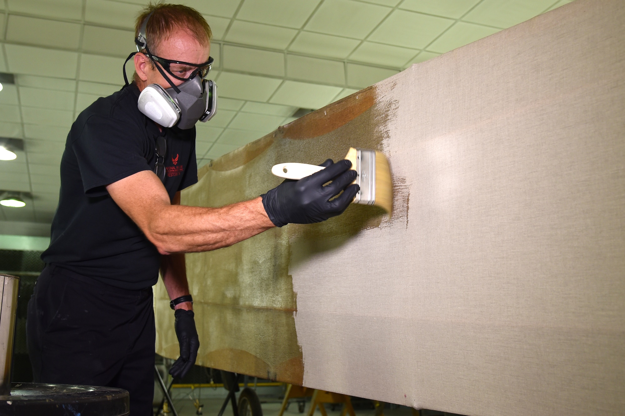 DAYTON, Ohio -- Museum restoration specialist Brian Lindamood applies 50/50 dope to the Avro 504K fuselage on Aug. 7, 2019. This aircraft was originally built in 1966 by the Royal Canadian Air Force's Aircraft Maintenance & Development Unit. Preserving the Air Force's proud legacy, the Restoration Division restores aircraft and aerospace vehicles to historically accurate and visually striking levels. (U.S. Air Force photo by Ken LaRock)