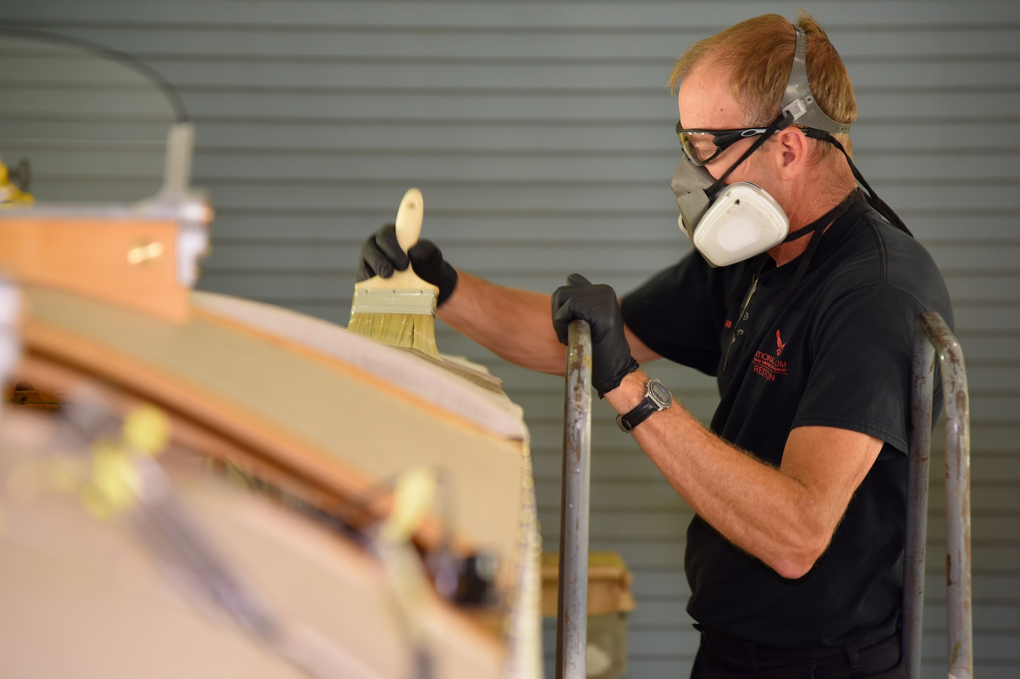 DAYTON, Ohio -- Museum restoration specialist Brian Lindamood applies 50/50 dope to the Avro 504K fuselage on Aug. 7, 2019. This aircraft was originally built in 1966 by the Royal Canadian Air Force's Aircraft Maintenance & Development Unit. Preserving the Air Force's proud legacy, the Restoration Division restores aircraft and aerospace vehicles to historically accurate and visually striking levels. (U.S. Air Force photo by Ken LaRock)