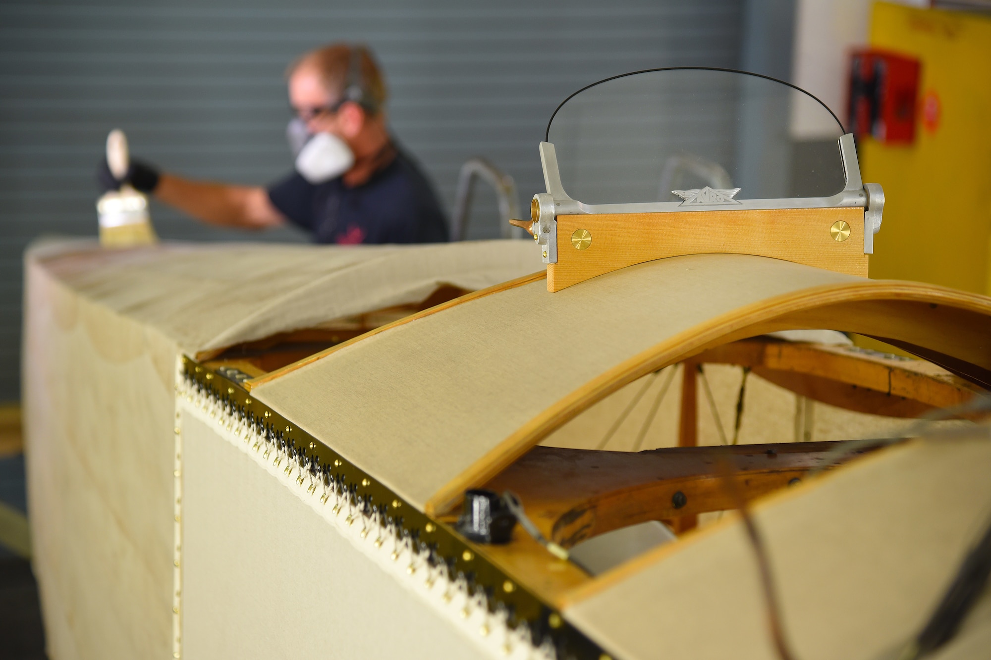 DAYTON, Ohio -- Museum restoration specialist Brian Lindamood applies 50/50 dope to the Avro 504K fuselage on Aug. 7, 2019. This aircraft was originally built in 1966 by the Royal Canadian Air Force's Aircraft Maintenance & Development Unit. Preserving the Air Force's proud legacy, the Restoration Division restores aircraft and aerospace vehicles to historically accurate and visually striking levels. (U.S. Air Force photo by Ken LaRock)