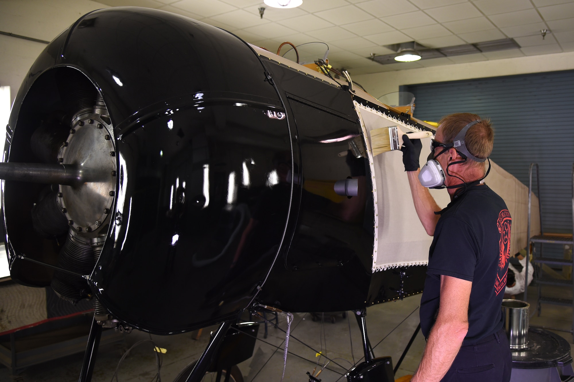 DAYTON, Ohio -- Museum restoration specialist Brian Lindamood applies 50/50 dope to the Avro 504K fuselage on Aug. 7, 2019. This aircraft was originally built in 1966 by the Royal Canadian Air Force's Aircraft Maintenance & Development Unit. Preserving the Air Force's proud legacy, the Restoration Division restores aircraft and aerospace vehicles to historically accurate and visually striking levels. (U.S. Air Force photo by Ken LaRock)