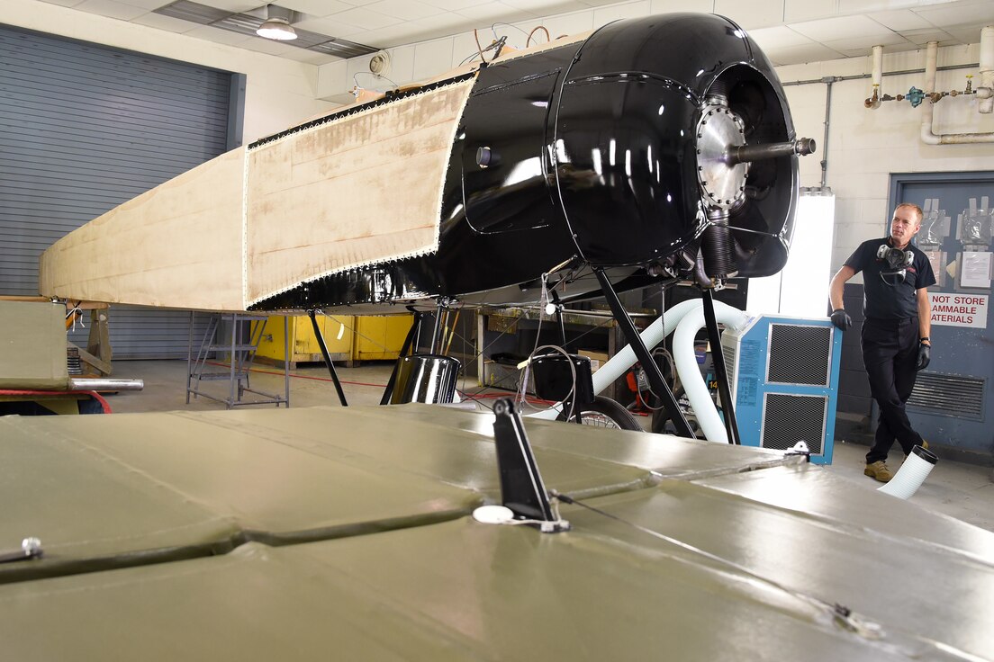 Museum restoration specialist Brian Lindamood checks the 50/50 dope on the Avro 504K fuselage.