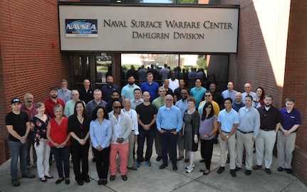 IMAGE: DAHLGREN, Va. (Aug. 8, 2019) - The CIAT – Combined Integrated Air and Missile Defense (IAMD) and Anti-Submarine Warfare (ASW) Trainer – team is pictured at Naval Surface Warfare Center (NSWC) Dahlgren Division headquarters. The team worked with NSWC Carderock Division to develop a technical approach that originated during the early stages of CIAT’s combat system virtualization and technology exploration. NSWC Dahlgren Division is the lead integrator and the IAMD developer for CIAT. NSWC Carderock Division is the ASW developer and Naval Undersea Warfare Center Newport Division is the ASW components developer. The three divisions delivered CIAT to the Fleet shore based facilities in 2018 as the most capable combat systems trainer ever developed for the Navy surface force.