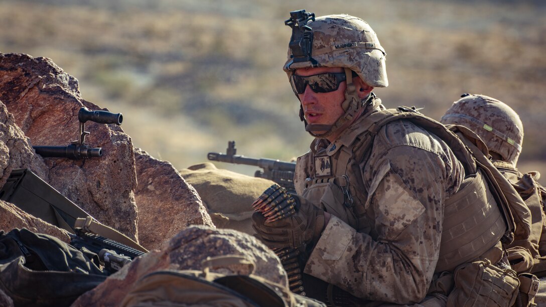 A U.S. Marine with 1st Battalion, 25th Marine Regiment, 4th Marine Division, reloads an M240 medium machine gun at Range 400 during Integrated Training Exercise 5-19 at Marine Corps Air Ground Combat Center Twentynine Palms, Calif., Aug. 5, 2019. Reserve Marines with 1/25 participate in ITX to prepare for their upcoming deployment to the Pacific Region. (U.S. Marine Corps photo by Lance Cpl. Jose Gonzalez)
