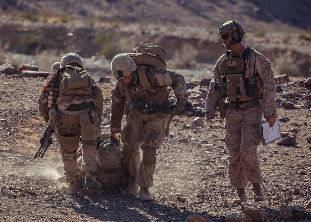 U.S. Marines with 1st Battalion, 25th Marine Regiment, 4th Marine Division, drag a simulated  casualty at Range 400 during Integrated Training Exercise 5-19 at Marine Corps Air Ground Combat Center Twentynine Palms, Calif., Aug. 5, 2019. Reserve Marines with 1/25 participate in ITX to prepare for their upcoming deployment to the Pacific Region. (U.S. Marine Corps photo by Lance Cpl. Jose Gonzalez)