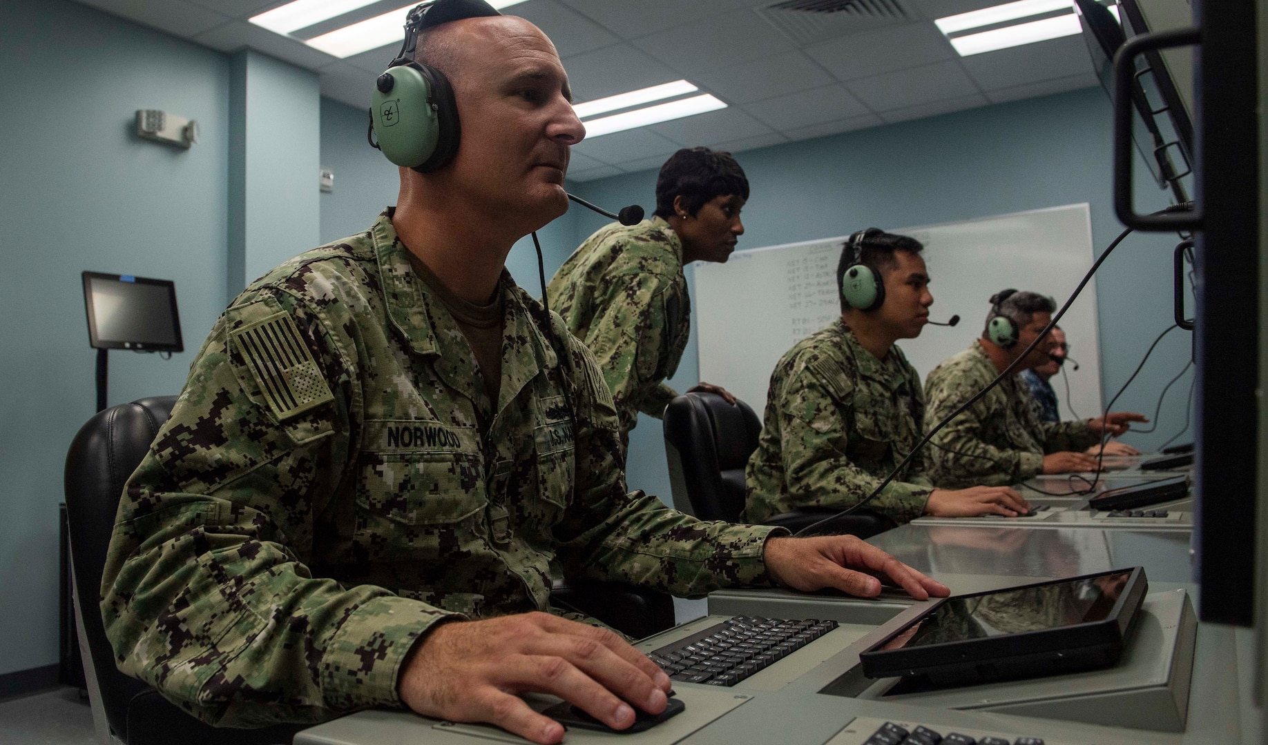 IMAGE: 190611-N-HV059-1005 NORFOLK (June 11, 2019) Sonar Technician 1st Class Christopher Norwood trains on a console in a simulated sonar room at the Center for Surface Combat Systems' (CSCS) Combined Integrated Air and Missile Defense (IAMD) / Anti-Submarine Warfare (ASW) Trainer (CIAT), onboard Naval Base Norfolk.  CSCS’ main mission is to develop and deliver surface ship combat systems training to the fleet and achieve surface warfare superiority. (U.S. Navy photo by Mass Communication Specialist 2nd Class Sonja Wickard/Released)