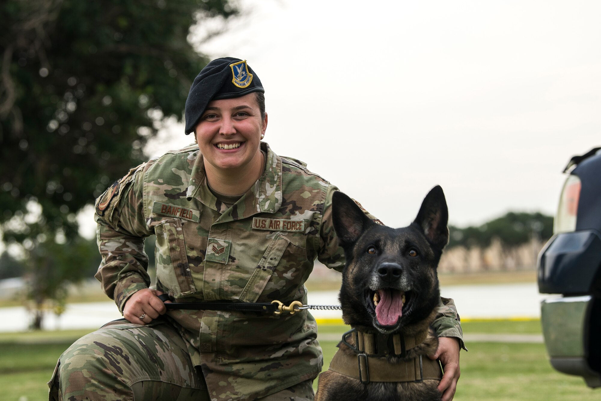 Senior Airman Eryn Banfield, 27th Special Operations Security Forces Squadron military working dog handler, and MWD Ari Valdo, finish a demonstration at the National Night Out in Clovis, N.M., August 6, 2019. The demonstration went over different scenarios to show the training of Cannon Air Force Base’s military working dogs. (U.S. Air Force photo by Senior Airman Vernon R. Walter III)