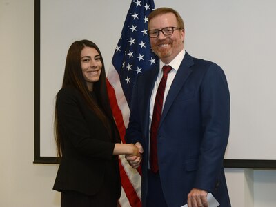 Oregon District Attorney for Deschutes County John Hummel  congratulates Jasmyn Troncoso after she completes the oath of office as she becomes the newest deputy district attorney for Deschutes County, Aug. 5, 2019, at the Oregon Youth ChalleNGe Program (OYCP) campus, Bend, Oregon. Troncoso graduated from OYCP in 2006 and credits the program to help change her life and the desire to become an attorney.