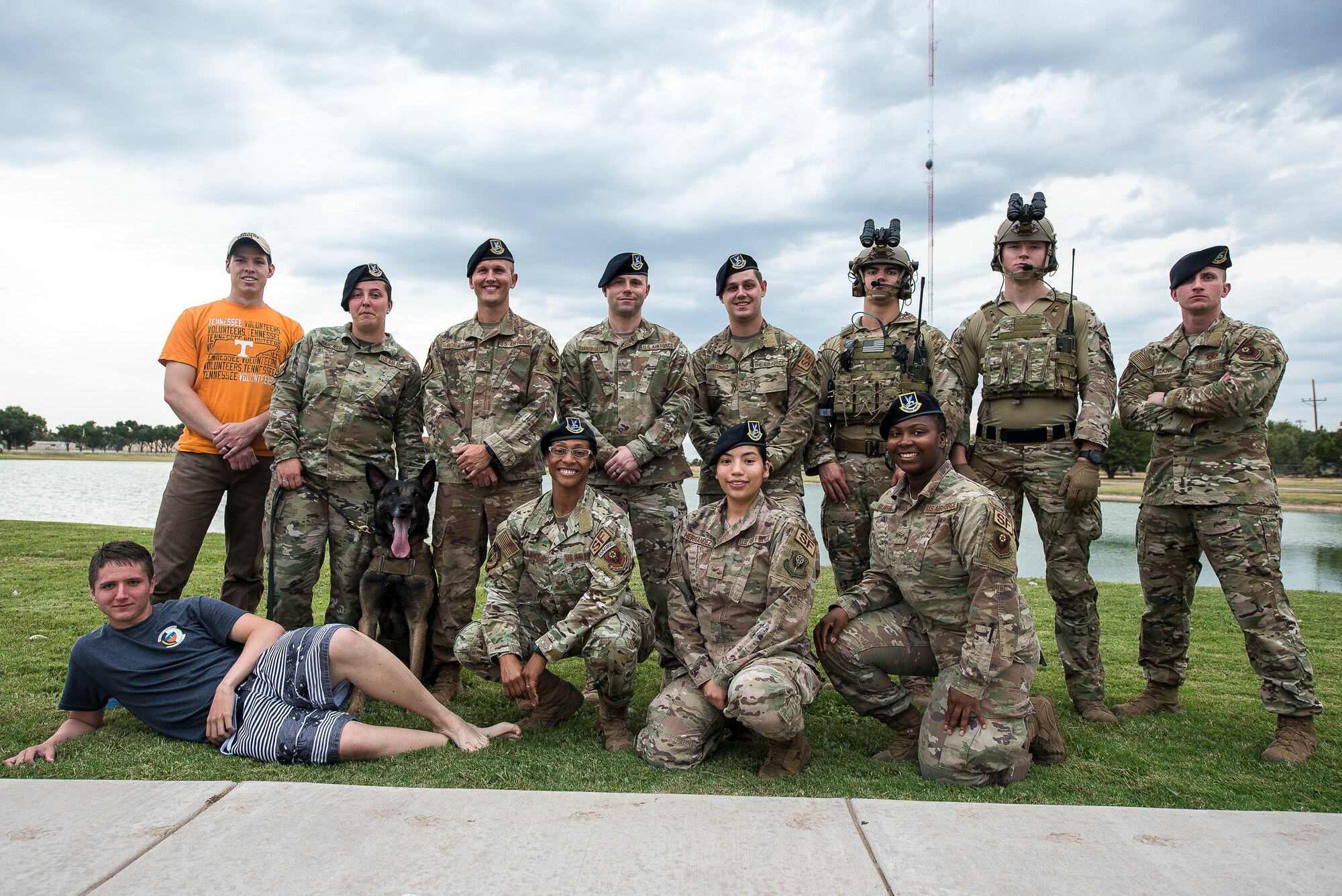 Members of the 27th Special Operations Security Forces Squadron pose for a photo after volunteering at the National Night Out in Clovis, N.M., August 6, 2019. The members hosted events such as a dunk tank, face painting, a military working dog demonstration and instructional course on the dangers of drunk driving. (U.S. Air Force photo by Senior Airman Vernon R. Walter III)