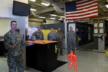 Col. Scott, 432nd Maintenance Group Commander, speaks to Tiger Aircraft Maintenance Unit Airmen at Creech Air Force Base, Nevada, July 29, 2019. Scott officiated the ribbon cutting ceremony at the new section. (U.S. Air Force photo by Airman 1st Class William Rio Rosado)