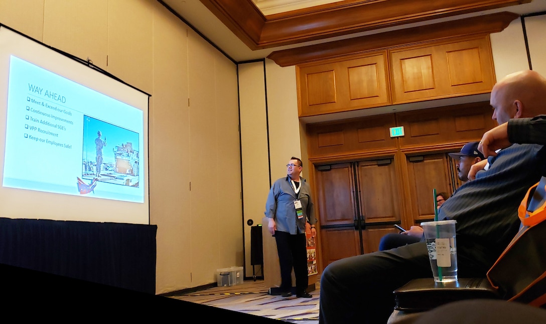 Isaac Padilla, Special Government Employee with the Voluntary Protection Program committee aboard Marine Corps Logistics Base Barstow, Calif., presents a class on how to achieve the VPP Safety Star status to a crowd at the VPP Participants Association Safety Summit, April 17 in Tucson, Arizona. The SGE’s from MCLB Barstow have been extremely active in instructing both federal and private companies in the requirements to get their own Safety Star and is one of the reasons the installation won the Department of Defense VPP Safety Award.