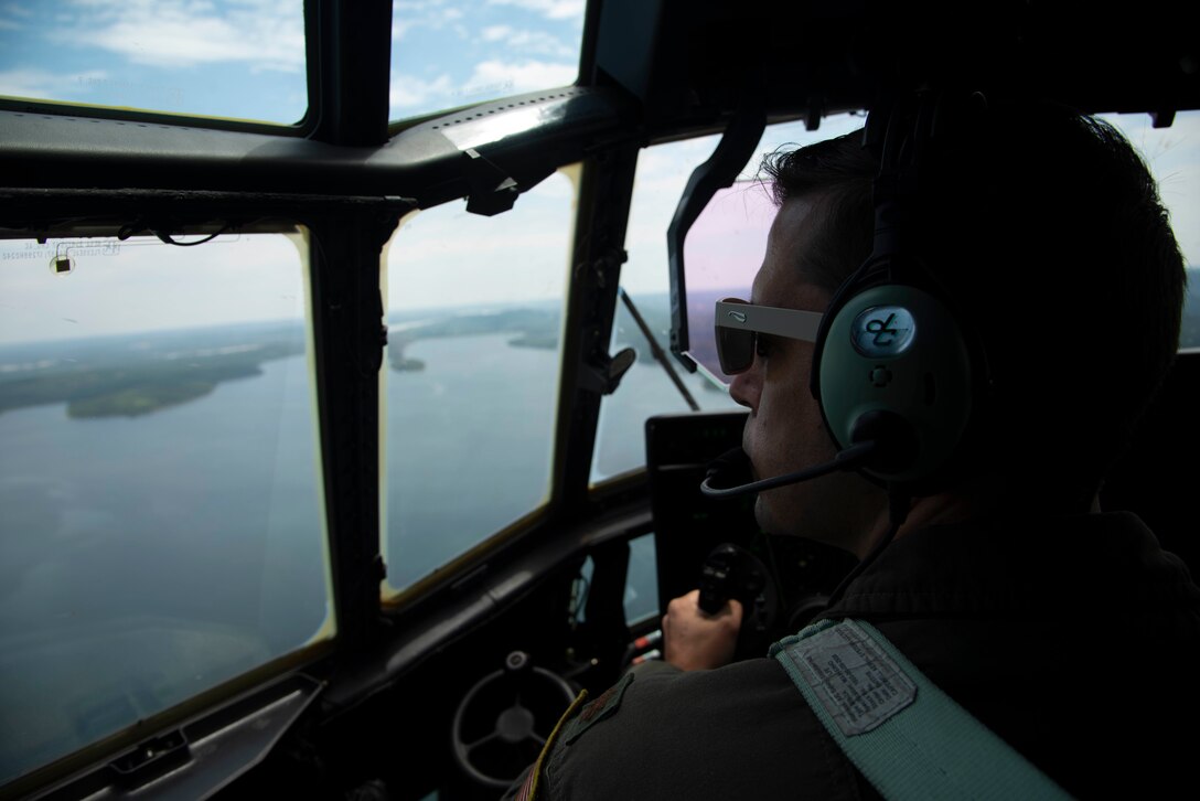 Maj. Seth Lake, 327th Airlift Squadron pilot, and Maj. Maj. Matthew Heisel, 327th Airlift Squadron pilot, participate in a training flight to enhance readiness on August 3, 2019, at Little Rock Air Force Base, Ark. The C-130 is a versatile aircraft that can be used for several different missions and the success of the mission depends upon teamwork and Airmen’s resiliency and their ability to overcome adversity. (U.S. Air Force photo by Senior Airman Chase Cannon)