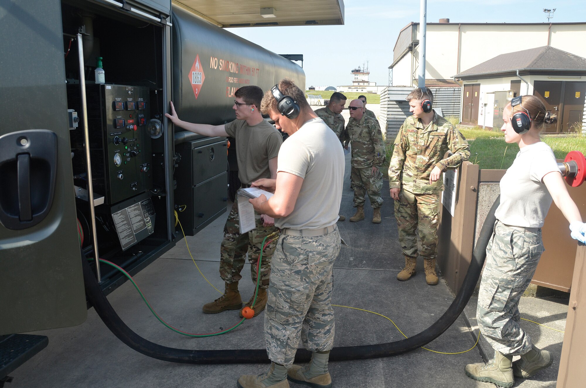 Fuel specialists with the 445th Logistics Readiness Squadron and the 52nd Logistics Readiness Squadron fill a fuel transport vehicle with fuel June 25, 2019, at Spangdahlem Air Base, Germany.