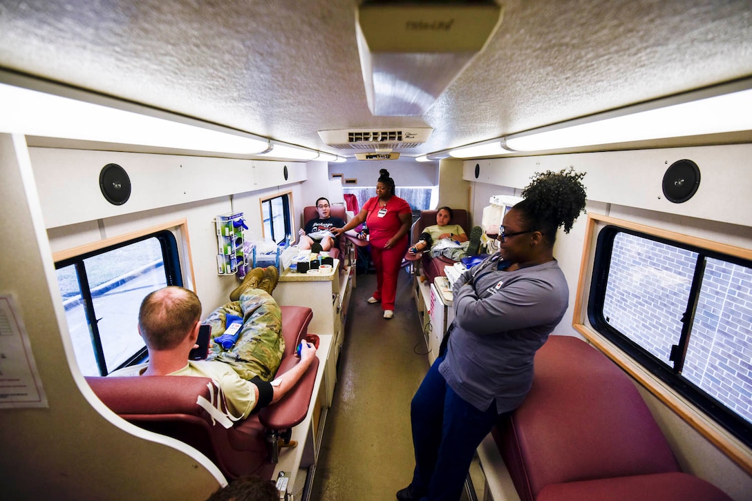 Team Little Rock Airmen donate blood and blood platelets during a blood drive held on August 4, 2019, at Little Rock Air Force Base, Ark. In order to extract platelets, specialists use apheresis machines to draw blood and return the unused portions of the donor. Platelets are tiny cells in the body that form clots and stop bleeding. They are essential to surviving traumatic injuries. Platelets must be used within five days and new donors are needed every day. (U.S. Air Force photo by Senior Airman Nathan Byrnes)