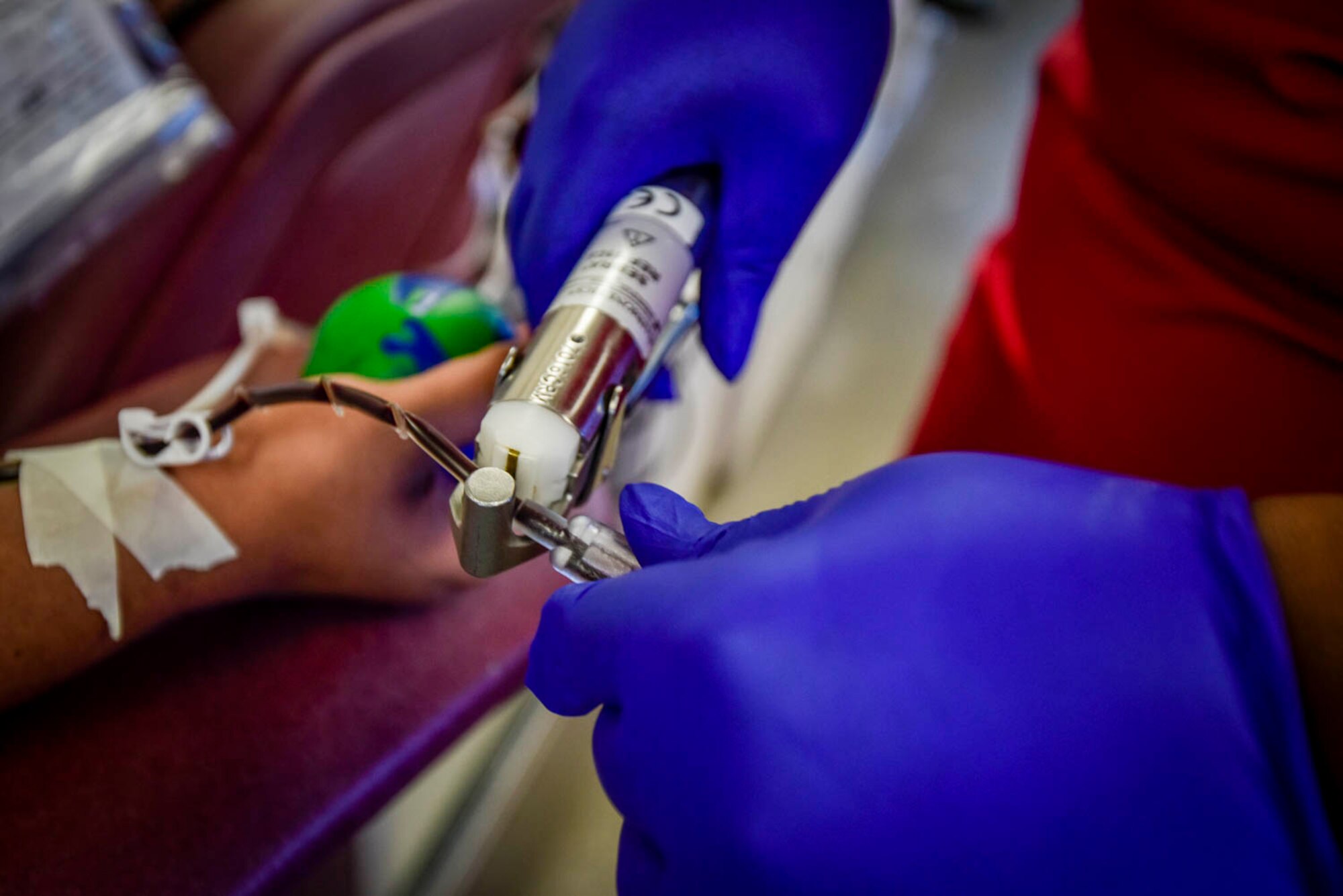 A collection specialist from the Arkansas Blood Institute draws blood from an Airman during the blood drive at Little Rock Air Force Base, Ark., August 4, 2019. The blood donation is a four-step process: registration, medical history and mini-physical, followed by the donation. Each donation of 1-pint can contribute to saving up to 3 lives. While Airmen’s main focus is readiness training during Unit Training Assembly, the blood drive allowed Airmen to take a break from training and give back to the community. (U.S. Air Force photo by Senior Airman Nathan Byrnes)