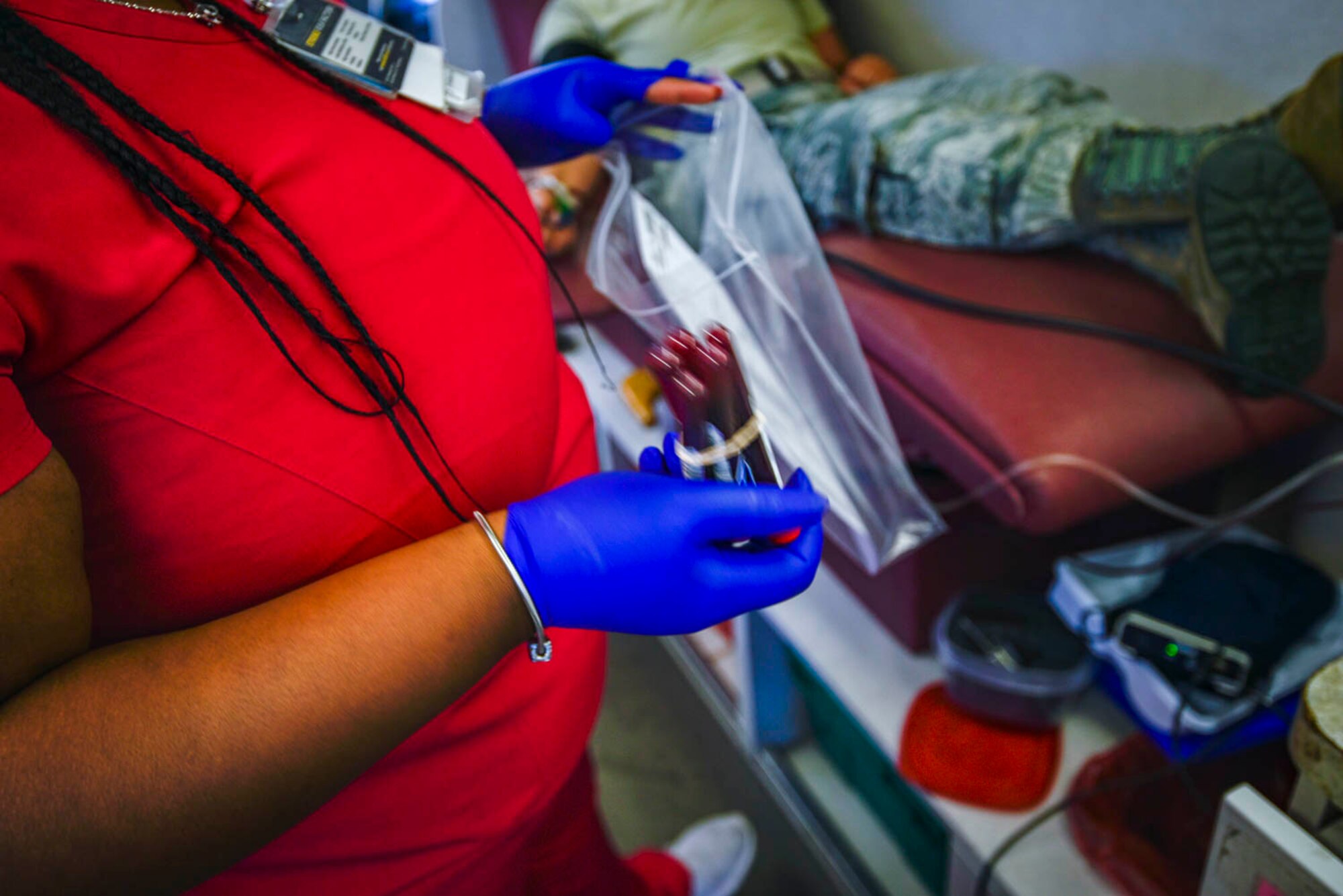 A collection specialist from the Arkansas Blood Institute draws blood from an Airman during the blood drive at Little Rock Air Force Base, Ark., August 4, 2019. The blood donation is a four-step process: registration, medical history and mini-physical, followed by the donation. Each donation of 1-pint can contribute to saving up to 3 lives. While Airmen’s main focus is readiness training during Unit Training Assembly, the blood drive allowed Airmen to take a break from training and give back to the community. (U.S. Air Force photo by Senior Airman Nathan Byrnes)