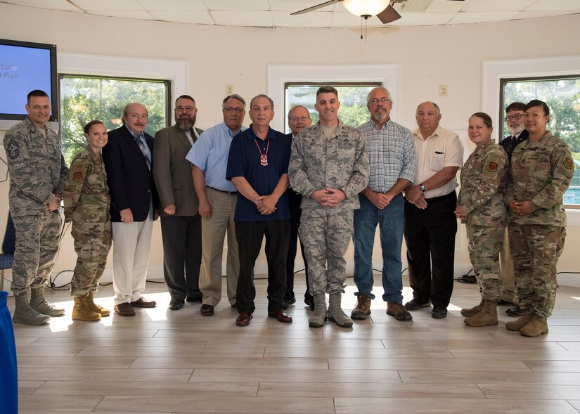 Joint Base Langley-Eustis leaders and members from four Native American groups pose for a photo during a tribe consultation tour at Fort Eustis, Virginia, Aug. 7, 2019.