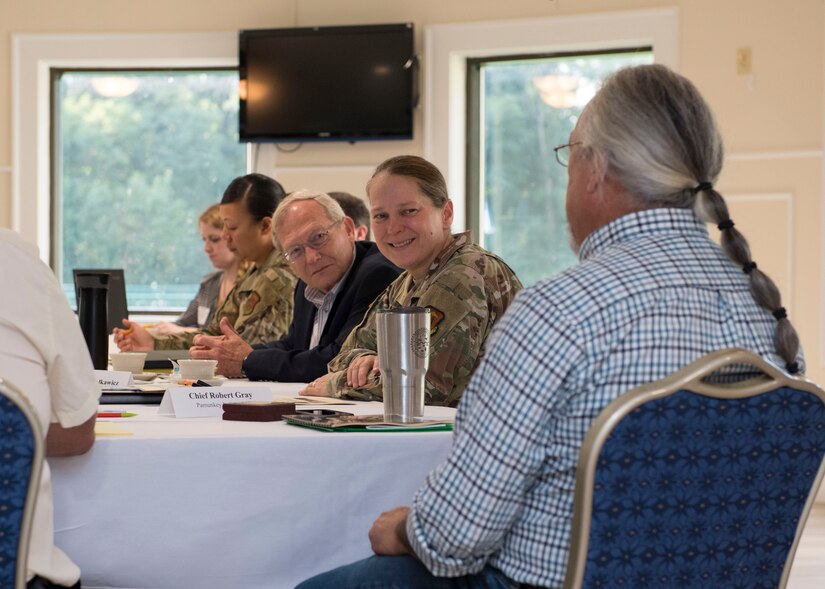 U.S. Army Col. Jennifer S. Walkawicz, 733rd Mission Support Group commander (center), speaks with a local Native American group representative during a tribe consultation tour at Fort Eustis, Virginia, Aug. 7, 2019.