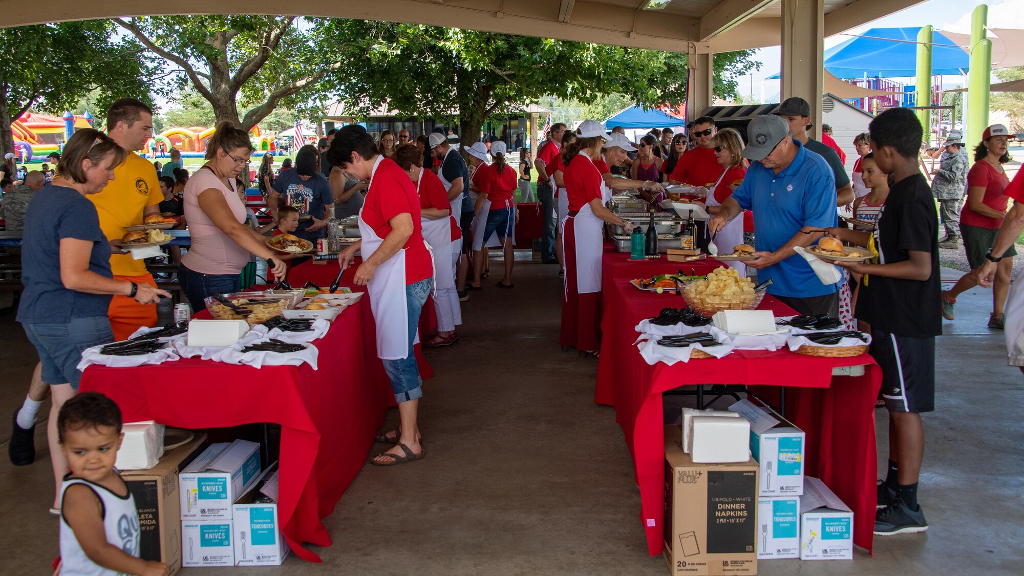 Families gathering during the annual Salute Picnic at Hill Air Force Base, Utah, Aug. 2. 2019. This was the 19th year the Top of Utah Military Affairs Committee sponsored the event for Hill's military and family members. The first event was held December 2001 as a welcome home celebration for military deployed following 9/11. (U.S. Air Force photo by R. Nial Bradshaw)