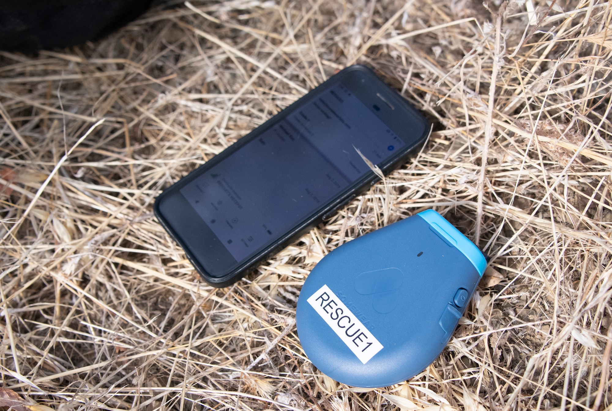 U.S. Air Force Survival, Evasion, Resistance and Escape personnel field test a developmental device Somewear Lab’s Hotspot Aug. 5, 2019, in a remote area near Travis Air Force Base, California. Paired with a combat-configured smartphone, the system supports digital maps for navigation, modern digital satellite messaging and data transmission, and comprehensive blue-force tracking for the tactical operations center or any command. This device is one of the lightest and smallest of its kind and a major enhancement from the current survival kit.