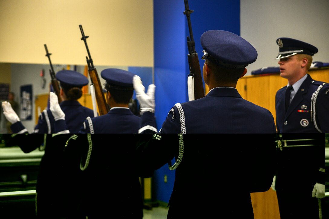 Members of the Kirtland Air Force Base Honor Guard Delta flight practice a gun salute.