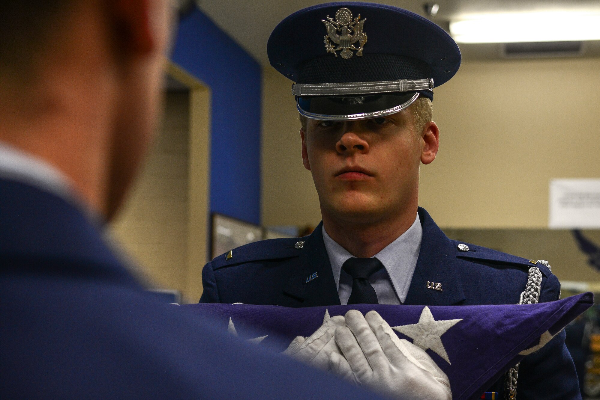U.S. Air Force 2nd Lt. Andrew Vogel, Kirtland Air Force Base Honor Guard Delta Flight officer in charge, takes part in a practice of a seven member funeral ceremony.