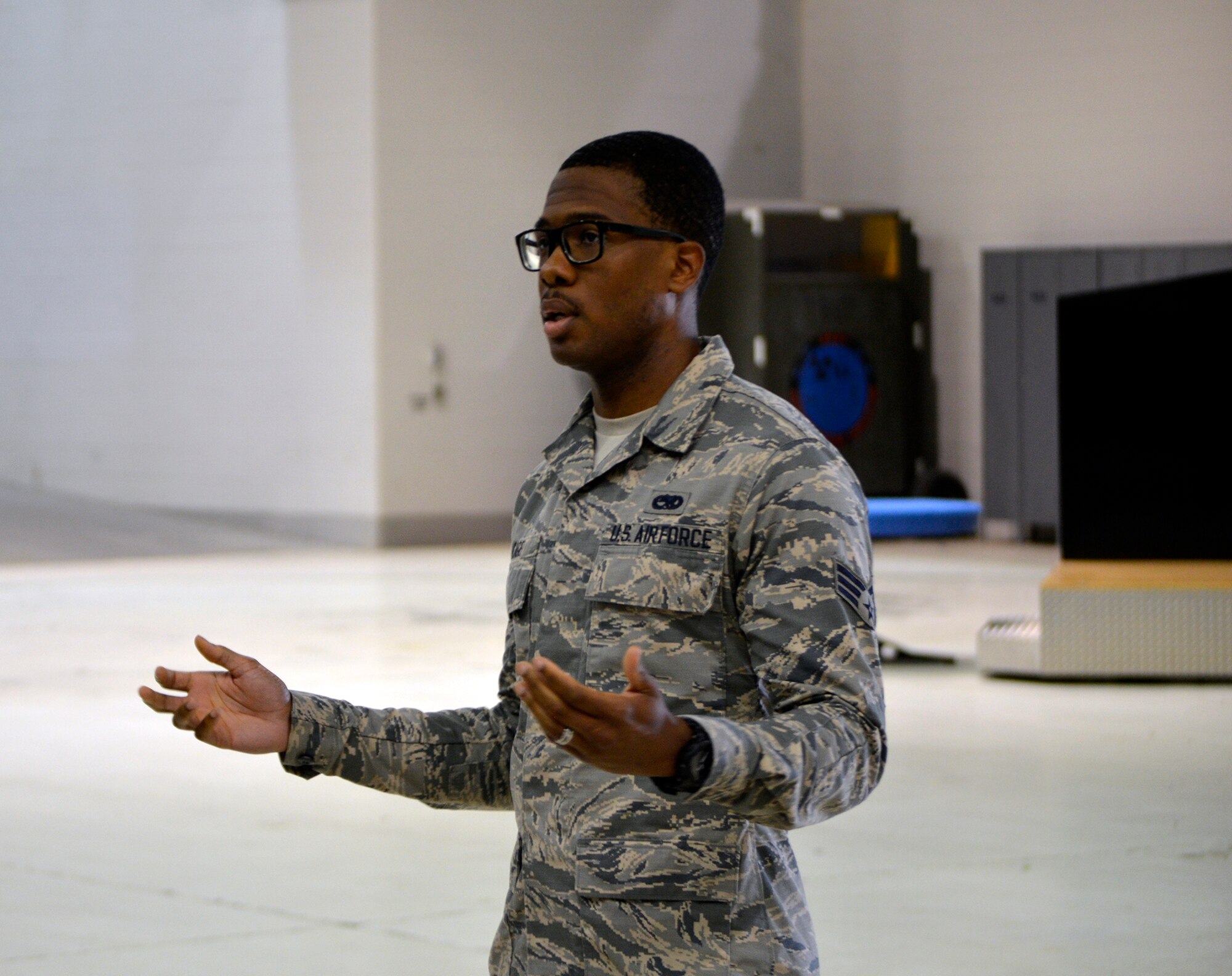 Senior Airman Michael Cage, a Home Station Check shop crew chief with the 445th Maintenance Squadron, addresses fellow Airmen during a morale group brief July 14, 2019.