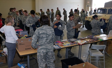 433rd Airlift Wing members pick up school supplies Aug. 4 at Joint Base San Antonio-Lackland. The Lackland Exceptional Family Member Program and the San Antonio Lighthouse for the Blind & Vision Impaired teamed together to provide no-cost backpacks and back-to-school supplies to Reserve Citizen Airmen with the Alamo Wing.