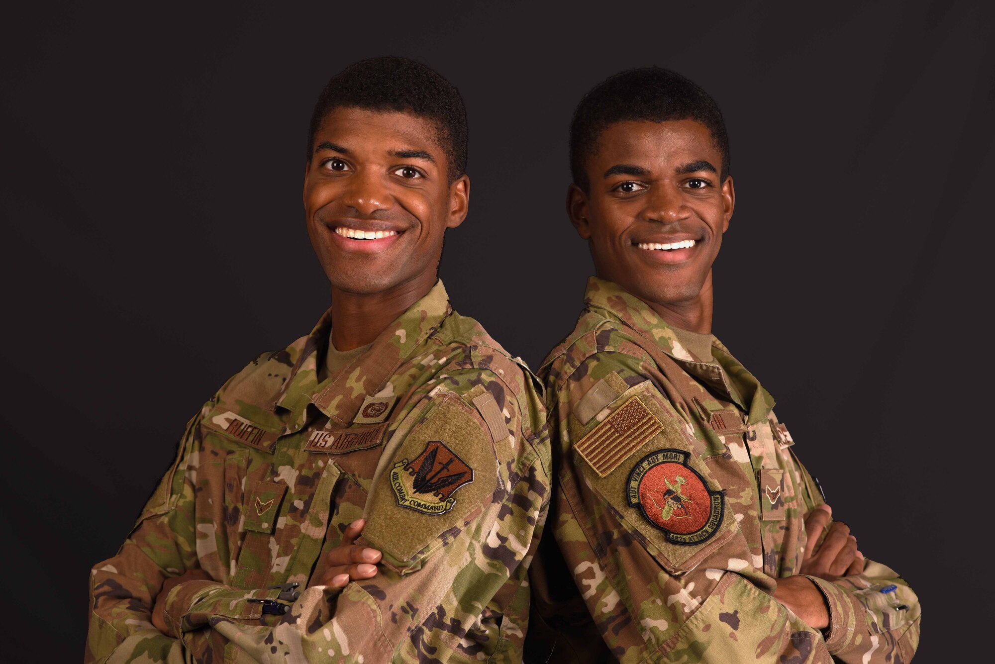From left, Airmen 1st Class Leernest Ruffin and LeNard Ruffin, 482nd Attack Squadron intel analysts, stand together at Shaw Air Force Base, South Carolina, July 29, 2019.