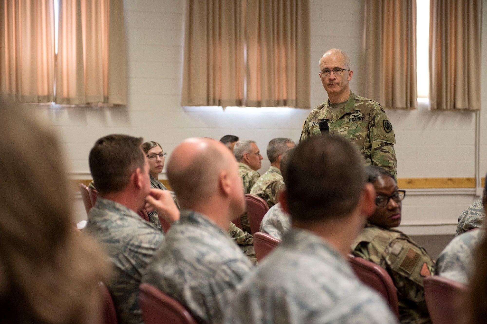 Maj. Gen. Ronald Place, Defense Health Agency acting assistant director for healthcare administration, listens to a question regarding DHA transition, Aug. 8, 2019, on Holloman Air Force Base, N.M. Place visited to ensure 49 MDG Airmen understand how the changes will affect medical group operations. (U.S. Air Force photo by Staff Sgt. Christine Groening)