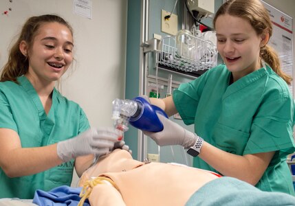Youth volunteers Sierra Trapolsi and Amber Miller intubate a simulated pediatric patient in the Simulation Center at Brooke Army Medical Center at Joint Base San Antonio-Fort Sam Houston July 9. BAMC’s Summer Youth Volunteer Program is an extension of the commanding general’s Community Outreach Program and is sponsored by the American Red Cross.