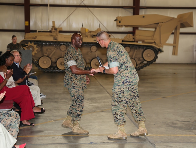 Col. Kipp Wahlgren, right, commanding officer, Marine Force Storage Command, welcomes Lt. Col. Fred Glencamp III, left, commanding officer, 2nd Marine Force Storage Battalion, during the battalion’s activation ceremony June 14.