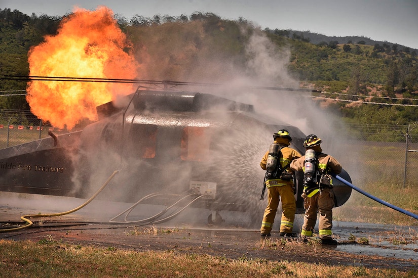 Firefighters fight helicopter blaze