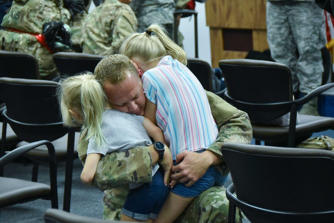 Nearly 70 301st Fighter Wing Reserve Citizen Airmen arrive to the hugs and kisses of family and friends at a welcome home
gathering at Naval Air Station Fort Worth Joint Reserve Base, Texas on July 26, 2019. The wing completed its deployment
to Campia Turzii, Romania, as part of Theater Security Package 19.1 in support of Operation Atlantic Resolve. (U.S. Air
Force photo by Mr. Jeremy Roman)