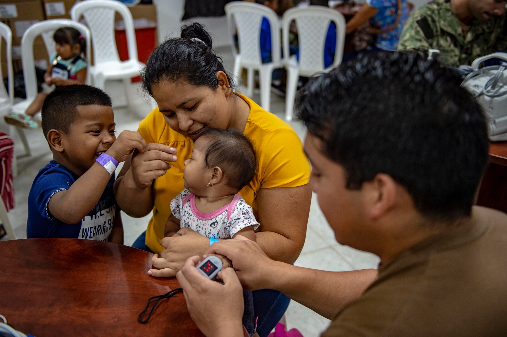 A corpsman takes a child's vitals.