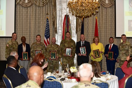 Gen. Paul E. Funk II, commanding general, U.S. Army Training and Doctrine Command, and TRADOC Command Sgt. Maj. Timothy A. Guden, pose for a group photo with the 2019 TRADOC Instructors of the Year at Fort Eustis, Va., Aug. 7, 2019. The seven awardees were recognized during the TRADOC Commander's Forum. (U.S. Army photo by Angel Clemons)