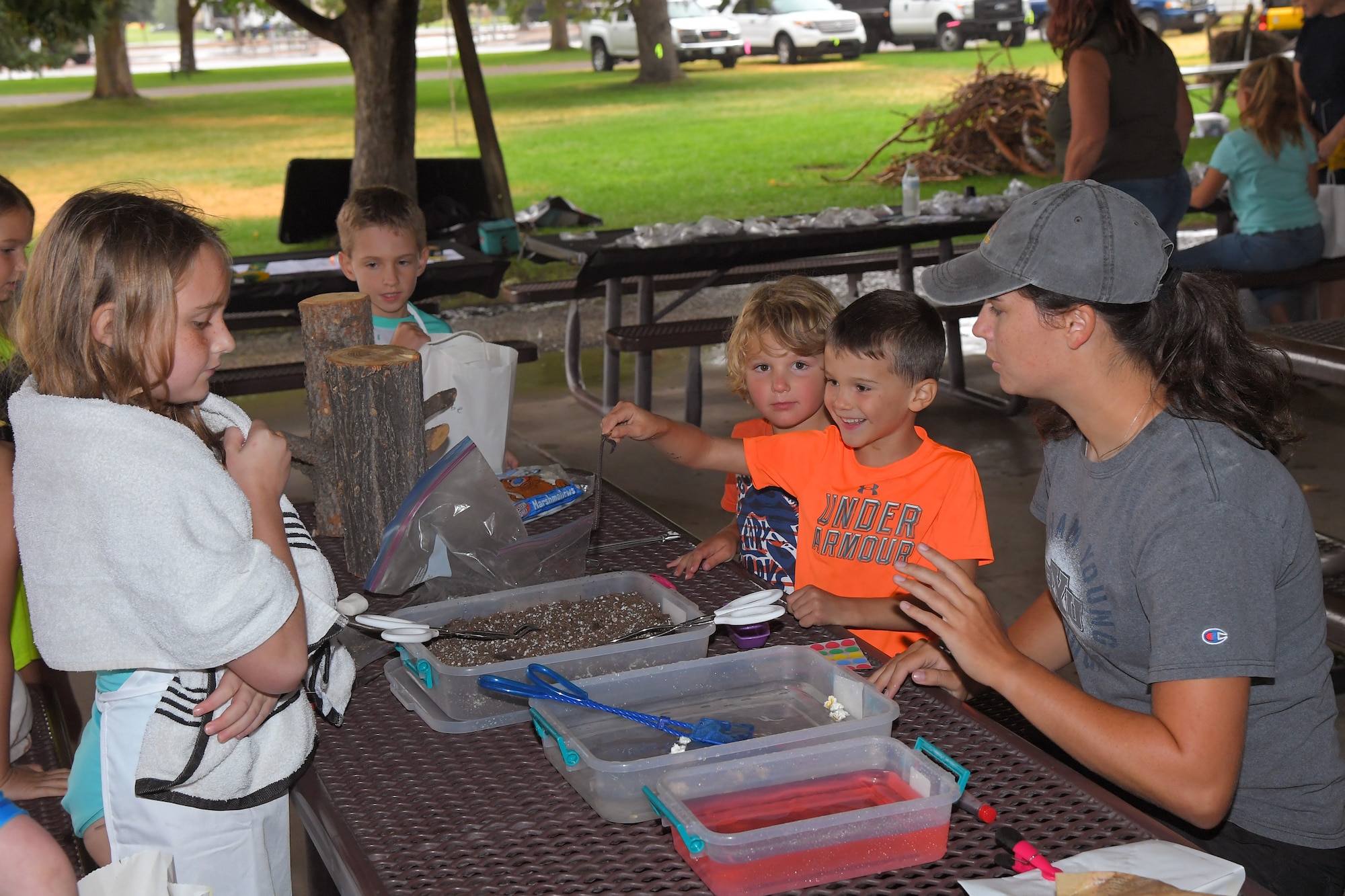 Children enjoy an earthworm activity with Teresa Whitesell (right), base wildlife technician, during the Kickin’ It for Conservation energy and environmental fair Aug. 8, 2019, at Hill Air Force Base, Utah. Although officially celebrated in April, the event served as the base’s commemoration of Earth Day and was an opportunity for children and adults to learn how to conserve energy and protect the environment. (U.S. Air Force photo by Todd Cromar)