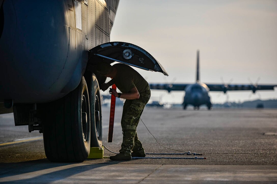 Tech. Sgt. William Mcleod, 327th Airlift Squadron loadmaster, conducts pre-flight checks before take-off as part of the Turkey Shoot competition August 7, 2019, at Little Rock Air Force Base, Ark. The Turkey Shoot is a multi-event test which evaluates all aspects of combat airlift such as threat mitigation, container delivery system airdrops, assault landings and loading and offloading vehicles. The majority of our Reserve members must meet the same requirements of Active Duty personnel. This entails balancing a fulltime civilian job or college studies while maintaining their military readiness. (U.S. Air Force Reserve photo by Senior Airman Nathan Byrnes)