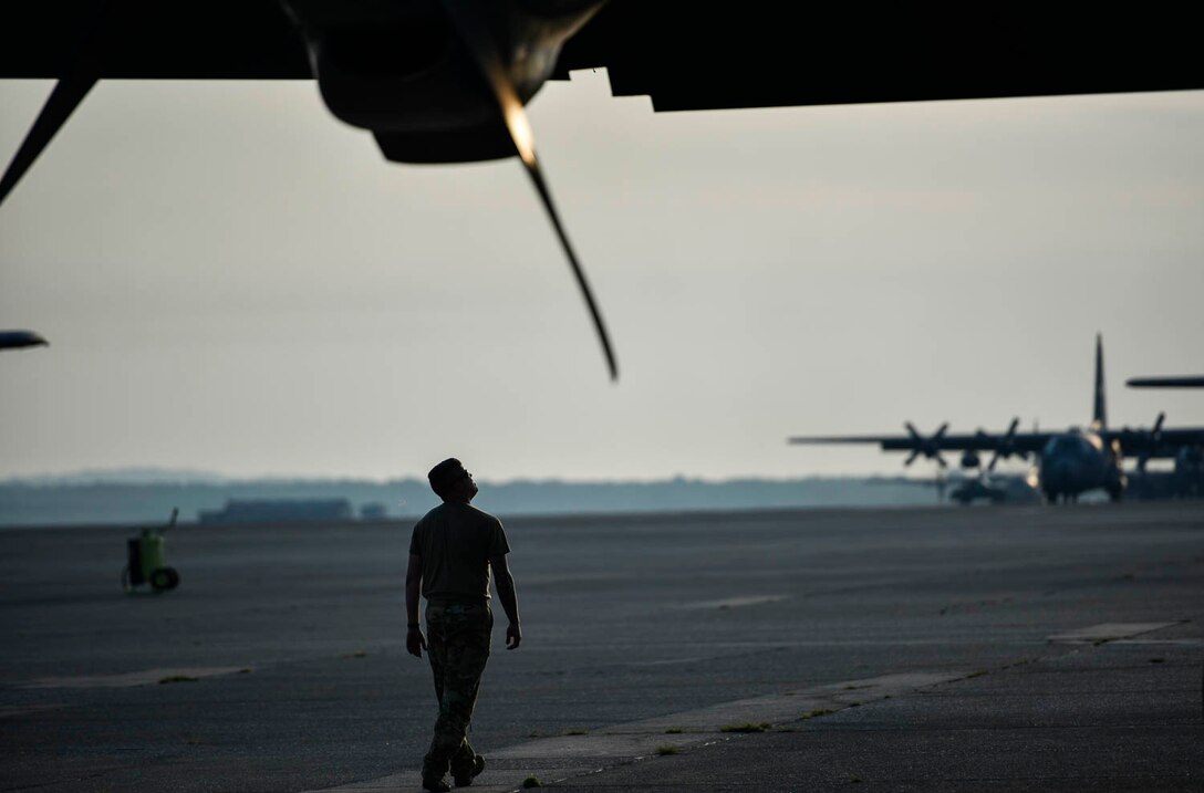 Tech. Sgt. William Mcleod, 327th Airlift Squadron loadmaster, conducts pre-flight checks before take-off as part of the Turkey Shoot competition August 7, 2019, at Little Rock Air Force Base, Ark. The Turkey Shoot is a multi-event test which evaluates all aspects of combat airlift such as threat mitigation, container delivery system airdrops, assault landings and loading and offloading vehicles. The majority of our Reserve members must meet the same requirements of Active Duty personnel. This entails balancing a fulltime civilian job or college studies while maintaining their military readiness. (U.S. Air Force Reserve photo by Senior Airman Nathan Byrnes)