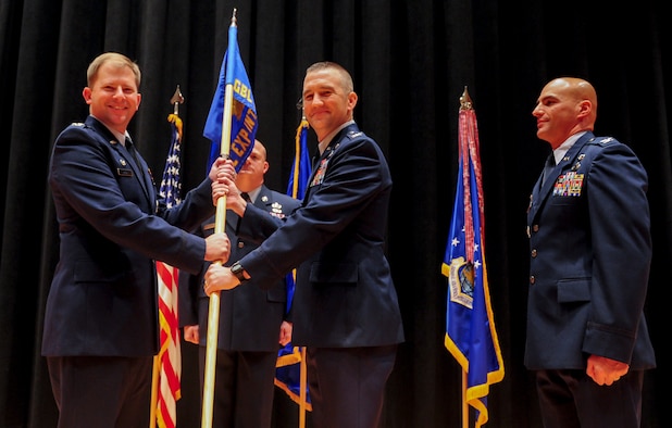 Col. Duane J. Diesing accepts command of the National Air and Space Intelligence Center’s Global Exploitation Intelligence Group from Col. Parker H. Wright, NASIC commander, July 27. GX is responsible for executing analysis of signals intelligence, human intelligence, open source intelligence, and foreign materiel exploitation to create integrated intelligence for NASIC and the nation. (Air Force photo by Senior Airman Michael J. Hunsaker)