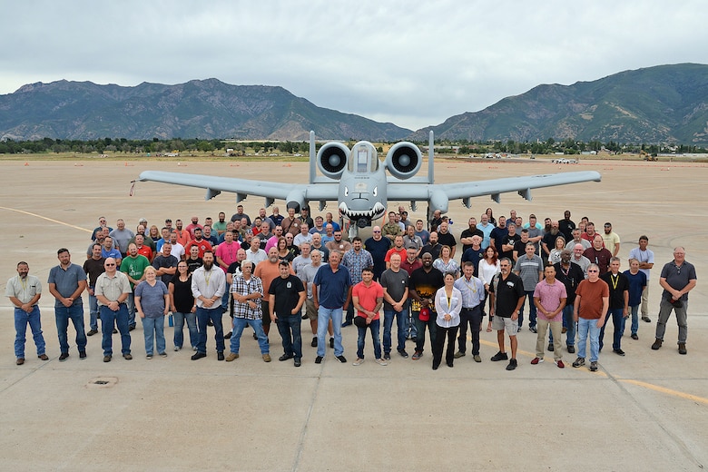 571st Aircraft Maintenance Squadron members in front of an A-10 Thunderbolt II, tail no. 80-0252, at Hill Air Force Base, Utah, July 31, 2019. The aircraft is from the Moody Air Force Base, Georgia, home of the 23d Wing Flying Tigers, a unit that traces its lineage back to the Flying Tigers of WWII that painted sharks teeth on the nose of the P-40 Warhawk fighter planes they flew. This is the last of 173 A-10 aircraft to receive new wings under the Enhanced Wing Assembly program to extend the flying service life of the A-10 fleet.  (U.S. Air Force photo by Alex R. Lloyd)