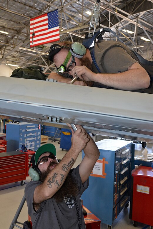 571st Aircraft Maintenance Squadron technicians Bridger Bodily (right) and Ryan Peterson, rig flight controls on the new Enhanced Wing Assembly on an A-10 Thunderbolt II, tail no. 80-0252, at Hill Air Force Base, Utah, June 16, 2019. The new wing is the last of 173 new wings that were produced to extend the flying service life of the A-10 fleet.  (U.S. Air Force photo by Alex R. Lloyd)