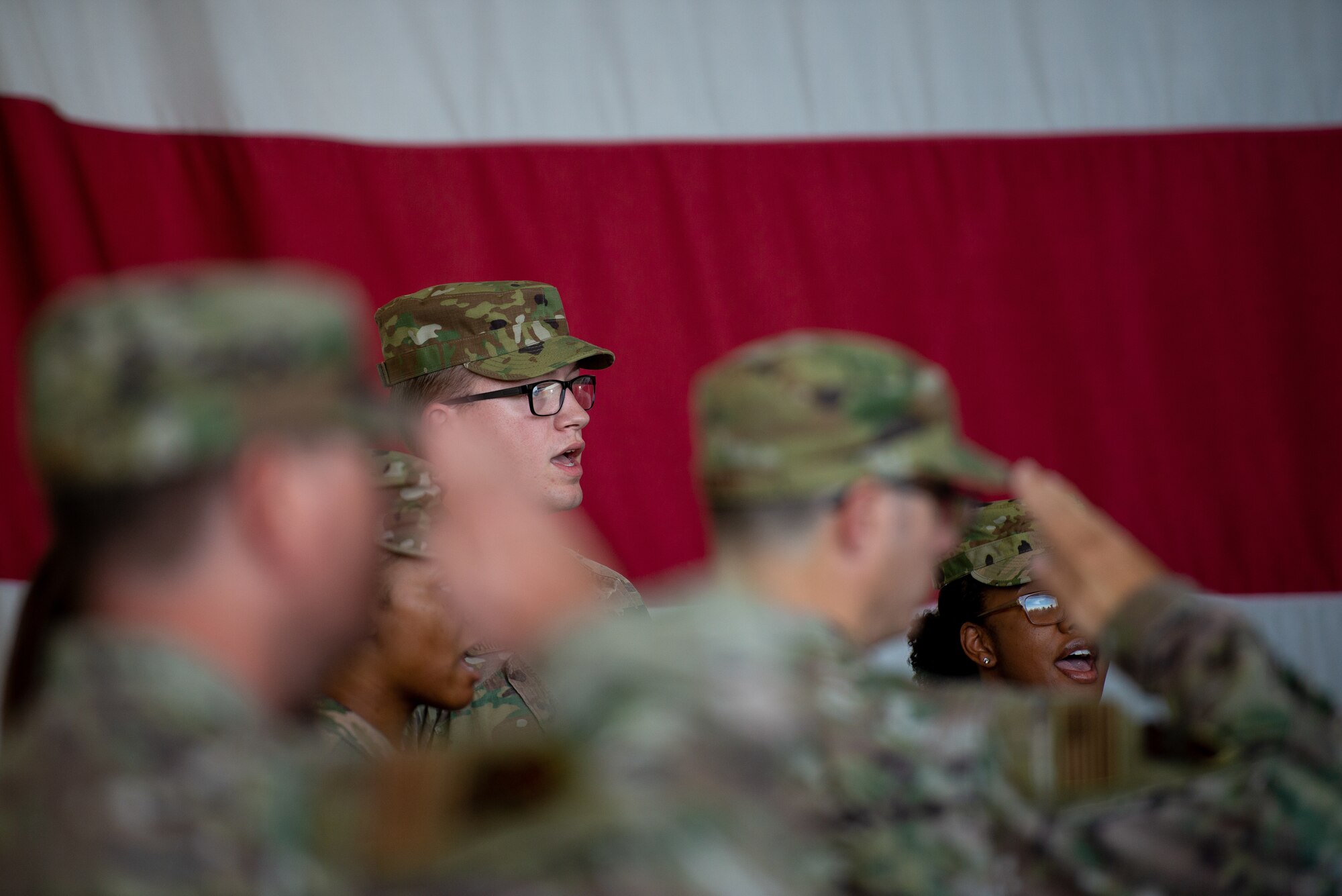 Airmen sing the national anthem in a trio at the 56th Mission Support Group change of command July 29, 2019, at Luke Air Force Base, Ariz.