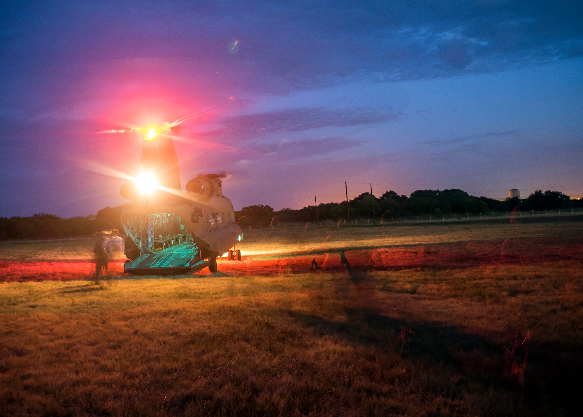 Staff Weather Officers (SWO) from the 3d Weather Squadron, depart a CH47-Chinook during a certification field exercise (CFX), July 29, 2019, at Camp Bowie Training Center, Texas.  The CFX was designed to evaluate the squadron’s overall tactical ability and readiness to provide the U.S. Army with full spectrum environmental support to the Joint Task Force (JTF) fight. (U.S. Air Force photo by Airman 1st Class Eugene Oliver)