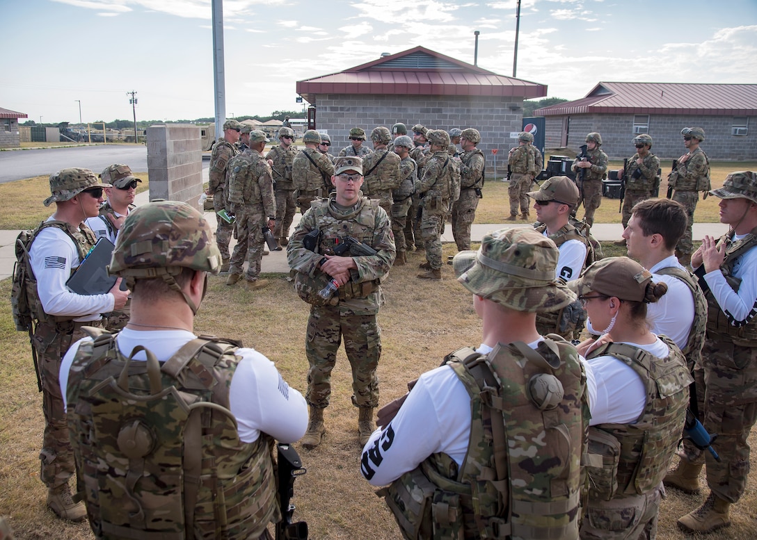 Lt. Col. Robert Nelson, center, 3d Weather Squadron commander, briefs evaluators during a certification field exercise (CFX), July 29, 2019, at Camp Bowie Training Center, Texas. The CFX was designed to evaluate the squadron’s overall tactical ability and readiness to provide the U.S. Army with full spectrum environmental support to the Joint Task Force (JTF) fight. While deployed, the Army relies on the 3d WS to provide them with current ground weather reports. These reports are then employed by commanders on the ground as they plan the best tactics and approaches to accomplish the mission. (U.S. Air Force photo by Airman 1st Class Eugene Oliver)