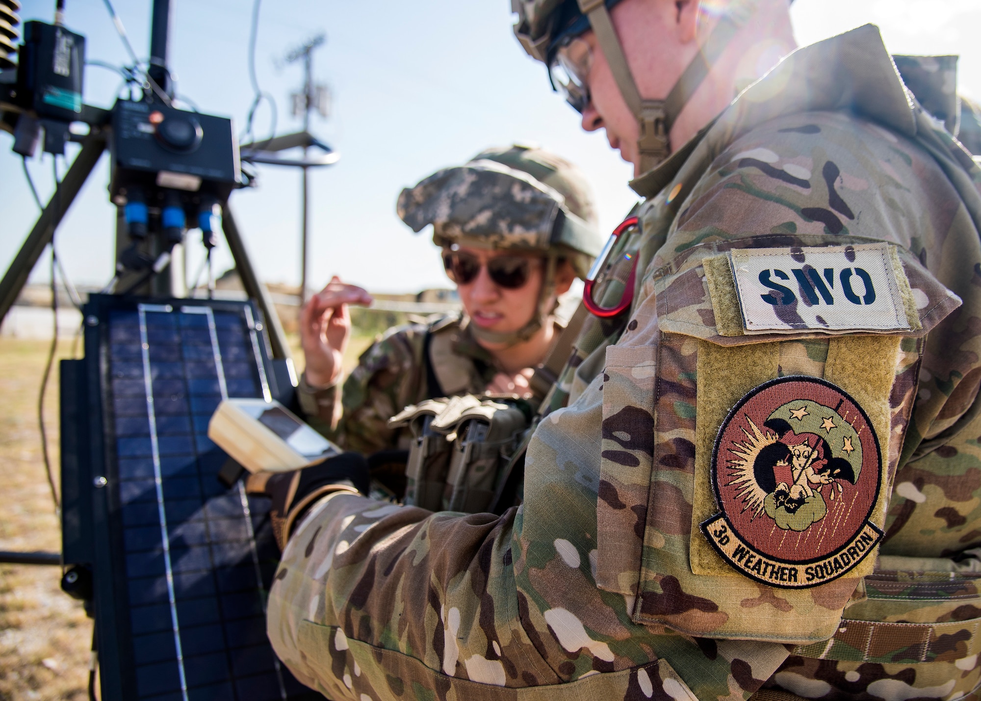Staff Weather Officers (SWO) from the 3d Weather Squadron (WS), inspect a tactical meteorlogical observing system, during a certification field exercise (CFX), July 29, 2019, at Camp Bowie Training Center, Texas. The CFX was designed to evaluate the squadron’s overall tactical ability and readiness to provide the U.S. Army with full spectrum environmental support to the Joint Task Force (JTF) fight. While deployed, the Army relies on the 3d WS to provide them with current ground weather reports. These reports are then employed by commanders on the ground as they plan the best tactics and approaches to accomplish the mission. (U.S. Air Force photo by Airman 1st Class Eugene Oliver)