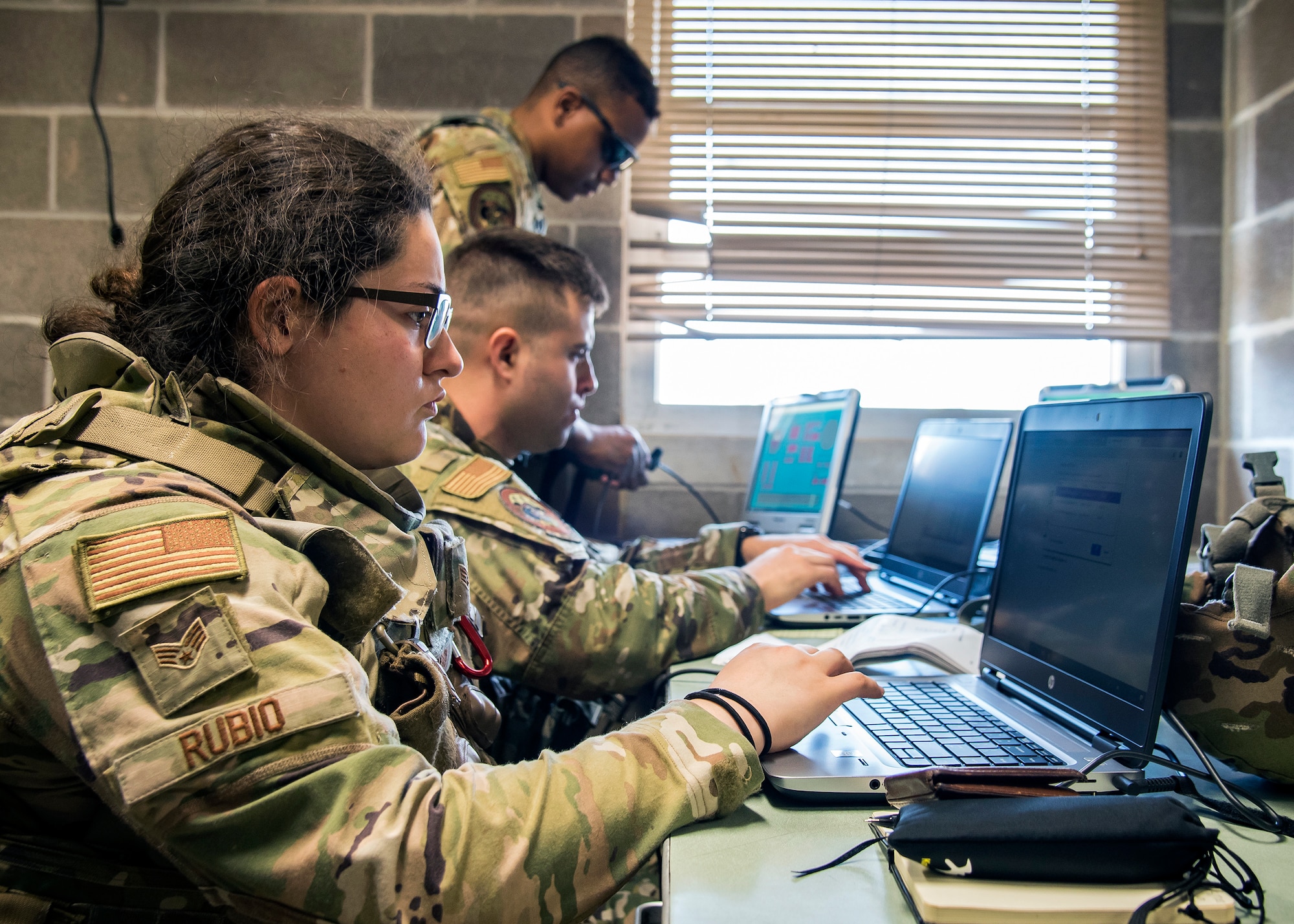 Staff Weather Officers from the 3d Weather Squadron (WS) input data into computers during a certification field exercise (CFX), July 29, 2019, at Camp Bowie Training Center, Texas. The CFX was designed to evaluate the squadron’s overall tactical ability and readiness to provide the U.S. Army with full spectrum environmental support to the Joint Task Force (JTF) fight. While deployed, the Army relies on the 3d WS to provide them with current ground weather reports. These reports are then employed by commanders on the ground as they plan the best tactics and approaches to accomplish the mission. (U.S. Air Force photo by Airman 1st Class Eugene Oliver)